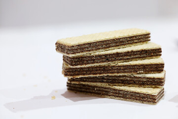 Background of long sweet chocolate wafers.