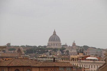 Fototapeta na wymiar view of the city of Rome in Italy with St. Peter's Cathedral dome and city rooftops
