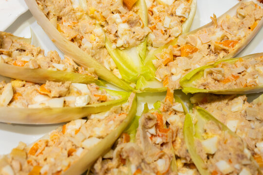 cichorium endive leaves stuffed with chaca with tuna egg crab sticks