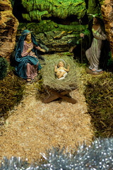 figures of a nativity scene with detail of the birth of the child jesus mary and joseph