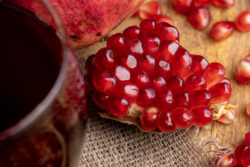 Red pomegranate ripe and lying on the table