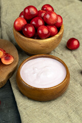 Fototapeta na wymiar yogurt with taste and pieces of cherries