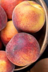Fototapeta na wymiar ripe delicious and fresh peaches of a red hue