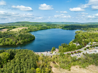 Laurel Lake in Leenox Massachusetts. Lee Massachusetts. Summer View with White Puffy Clouds