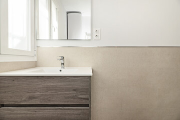 Bathroom wall with a brand new wooden cabinet