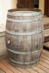 Traditional wooden barrel on street outdoors. Wine making