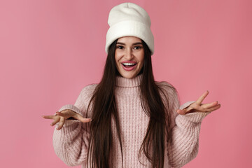 funny woman in white hat, sweater grimacing with lips - obrazy, fototapety, plakaty