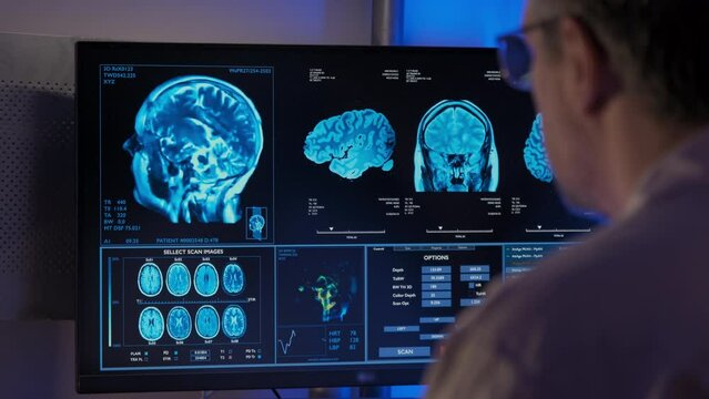 Man Doctor analyzing MRI in a hospital office.