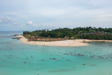 Aerial view of clear blue turquoise seawater, Andaman sea in Phuket island in summer season, Thailand. Water in ocean pattern texture wallpaper background.
