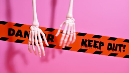 Creative Pastel Halloween Background: Unique Decor with Hanging Hands
