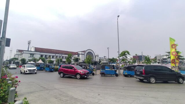 Jakarta, Indonesia - July 22, 2023: Row of bajaj parked on the side of the road at Kota Tua Jakarta. Waiting for passenger. Blue Bajaj is a three-wheeled public transportation.