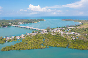 Fototapeta premium Aerial view of Sarasin Bridge with clear blue turquoise seawater, Andaman sea in Phuket island in summer season, Thailand. Water in ocean material pattern texture wallpaper background.