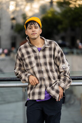 Latino young man with headphones listening to music