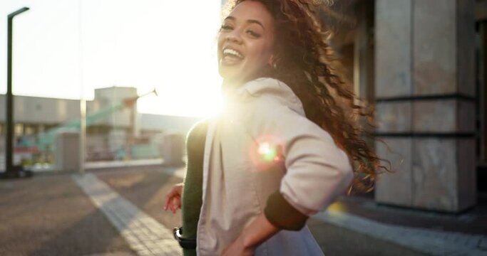 Happy, woman, dancing and city in morning with sunshine, happiness and celebration of wellness or freedom. Employee, energy and music audio with person in street with crazy, action or expression