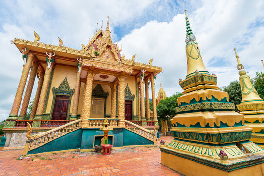 An ornate Buddhist temple with a gold chedi at Tri Ton in Vietnam