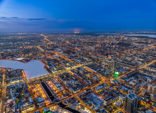 Embankment of the central pond and Plotinka in Yekaterinburg at winter sunset. The historic center of the city of Yekaterinburg, Russia, Aerial View