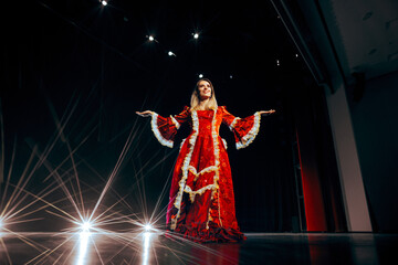 
Beautiful Actress Wearing a Princess Dress Greeting the Public. Professional actor wearing a...
