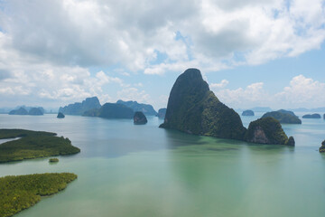 Aerial top view of Samet Nangshe, Phang Nga, lush green trees from above in tropical forest in national park in summer season. Natural landscape. Pattern texture background.