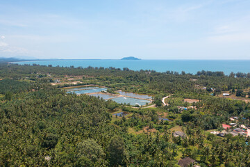 Fototapeta na wymiar Aerial view of natural sea salt ponds, lake or sea. Farm field outdoor in traditional industry in Thailand. Asia culture. Agriculture irrigation. River reflection.