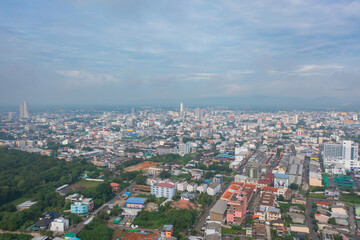 Fototapeta premium Aerial view of residential neighborhood roofs. Urban housing development from above. Top view. Real estate in Phuket, southern province city, Thailand. Property real estate.