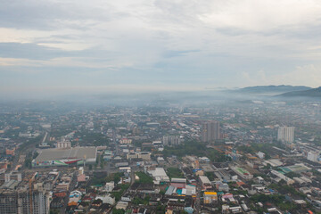 Naklejka premium Aerial view of residential neighborhood roofs. Urban housing development from above. Top view. Real estate in Phuket, southern province city, Thailand. Property real estate.