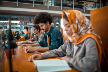 Diverse group of students studying in a college or university library