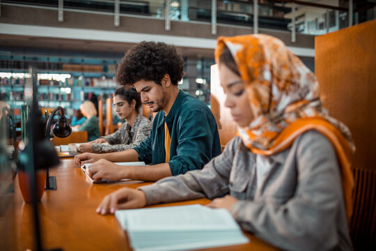 Diverse group of students studying in a college or university library