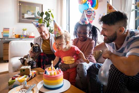 Young family celebrating a birthday at home