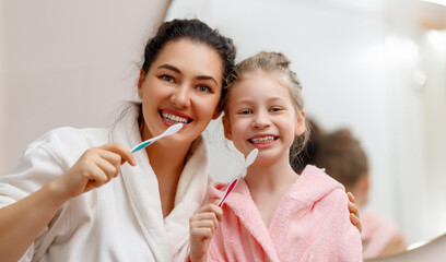 family are brushing teeth