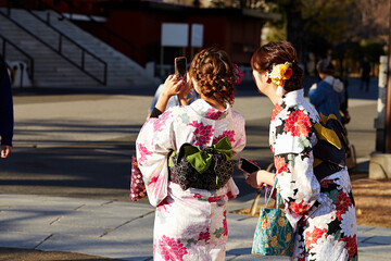 Back view of woman wearing yukata at temple