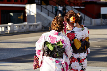 Back view of woman wearing yukata at temple