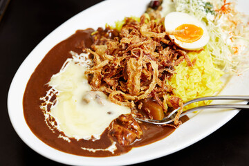 Curry and vegetable salad on a plate