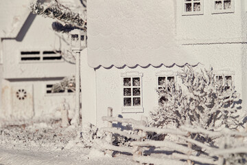 Snow-covered miniature houses, toy houses	