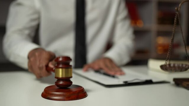 Young lawyer or legal advisor is reading and carefully checking the validity of documents and investment agreements for signing contracts managing justice concepts.