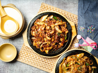Stir-fried octopus, stir-fried pork, and traditional alcohol