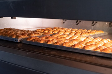 Rolls pastry baking in the bakery oven