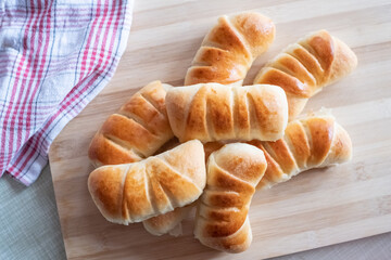 Tasty rolls on a wooden board