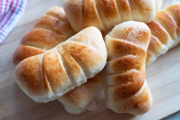 Tasty rolls on a wooden board