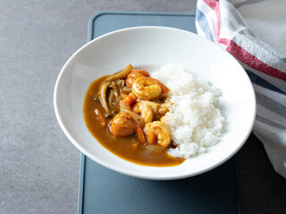 Shrimp and vegetable curry rice on a plate
