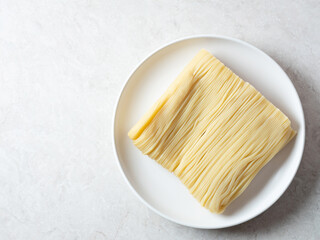 Fototapeta na wymiar Homemade noodles, semi-dried noodles on a plate