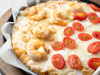 Pizza with tomatoes and shrimp