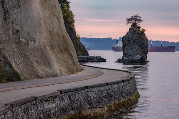 Seawall in Stanley Park during Dramatic Sunset on West Coast of Pacific Ocean.