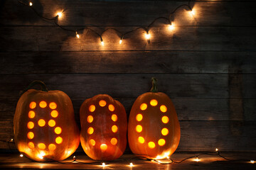 halloween pumpkins on old dark wooden background
