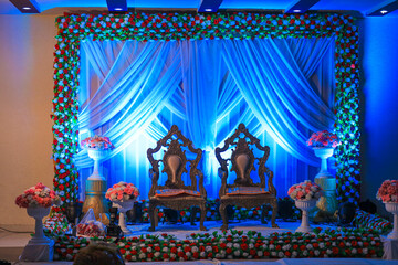 Indian Wedding Stage. Indian wedding decoration. Indian beautiful marriage decoration with flowers. Indian wedding sangeet night stage - obrazy, fototapety, plakaty