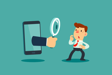 hand with magnifying glass out of smartphone screen looking at confused businessman