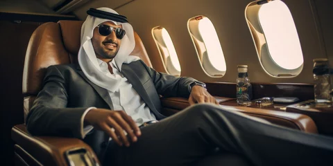 Wall murals Abu Dhabi Young Emirati businessman in UAE traditional seating in private jet