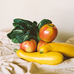 Assorted summer squash, apples, and bok choy, farm-fresh and vib