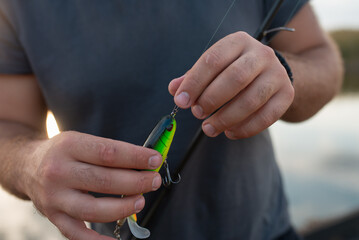 Fisherman setting up fishing lure