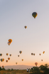 A couple in love against the background of balloons in Cappadocia