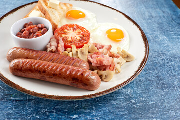 traditional breakfast with beans and sausage